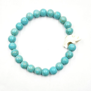 Bracciale di perline nere opache e turchesi con un simpatico ciondolo a forma di delfino