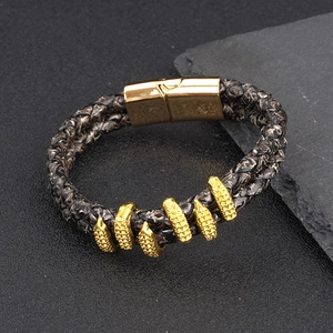 Men's double braided leather bracelet with gold magnetic clasp and metal rings decor