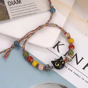 Handmade woven colorful string bracelet with ceramic beads and cute black cat charm