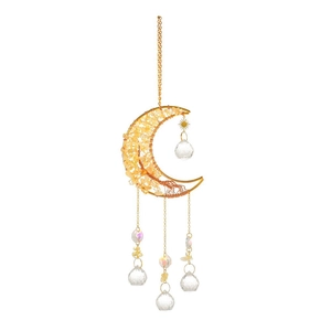 Close-up of golden moon suncatcher with yellow crystals and handcrafted tree of life detail