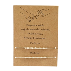 Adjustable hand-woven crystal bead bracelets set on a sentimental gift display card