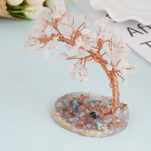 Handmade pink crystal money tree ornament on a natural stone base for home decor