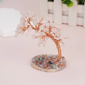 Detail of handmade crystal life tree with white quartz and a natural agate base
