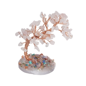 Handmade pink crystal tree of life sculpture on white base with colorful gemstones