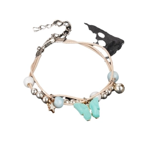 Handmade nautical braided bracelet with mint butterfly, gold star and beads on white background