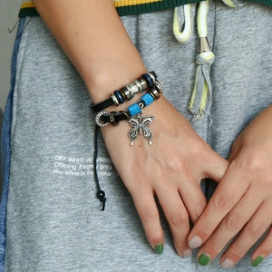 Handmade woven leather bracelet with alloy butterfly charm and beaded adjustable drawstring