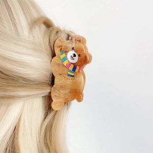Cute brown circus bear hair claw clip with colorful striped scarf and marble texture