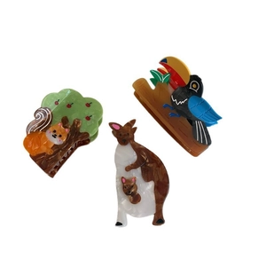 Whimsical acetate animal hair claws featuring fox, kangaroo and toucan designs