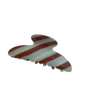 Brown striped acetate hair claw clip for elegant bun hairstyles on a white background