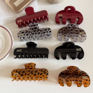 Elegant leopard print acetate hair claws in various shapes and colors for styling