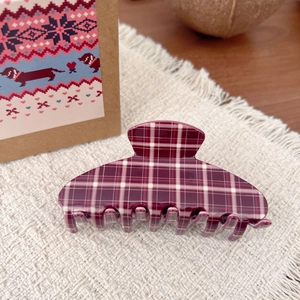 Vintage burgundy checkered large hair claw clip on a stylish cream woven background