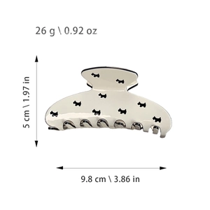 Large cream acetate hair claw clip with black puppy dog patterns for elegant styling