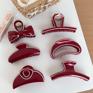 Elegant wine red hair claw set with white trim detail, six styles on white background