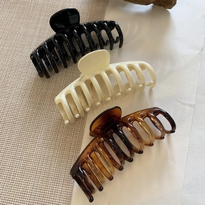Set of large resin hair claws in black, cream white and vintage tortoiseshell pattern