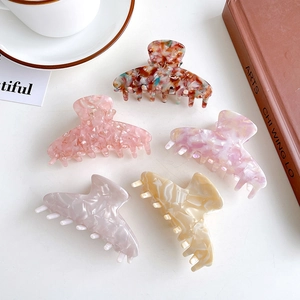 Set of five elegant acetate hair claws in various vintage marble and floral patterns