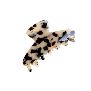 Elegant tortoiseshell acetate hair claw clip with vintage beige and brown leopard pattern
