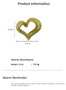 Detail view of a yellow heart-shaped hair claw clip with size 6.4x6.0cm and marble texture