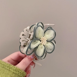 Elegant camellia hair claw clip with layered mesh petals and pearls for women