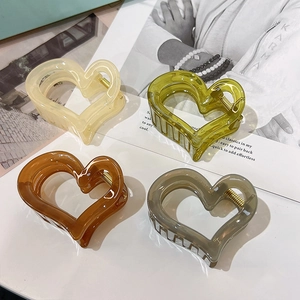 Set of 4 heart shaped resin hair claws in cream, olive, amber and clear transparent finish