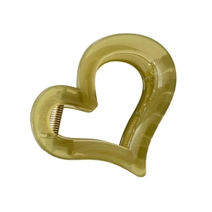 Cute heart-shaped hair claw clip in transparent olive green resin with gold spring