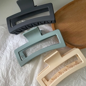 Three large matte rectangular hair claws in charcoal, Morandi green, and beige colors