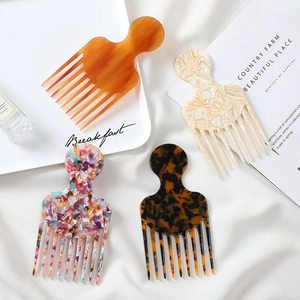 Set of 4 vintage acetate wide-tooth hair combs in marble and tortoiseshell patterns