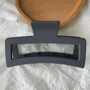 Detailed view of a 13cm charcoal grey matte hollow rectangular hair claw clip