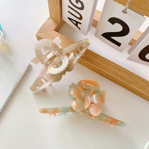 Elegant acetate butterfly hair claws with marble and gradient patterns for women