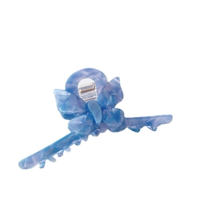 Elegant butterfly hair claw clip with blue marble acetate texture and metal spring detail
