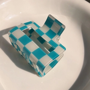 Classic blue and white checkered hair claw clip made of polished acrylic material