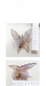 Detail view of acetate butterfly hair claw clip showing dimensions of 8cm by 7cm