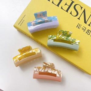 Set of four bicolor acetate hollow square hair claws in Morandi tones and marble texture