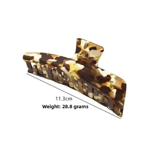 Detail view of 11.3cm acetate hair claw clip in tortoise shell leopard pattern