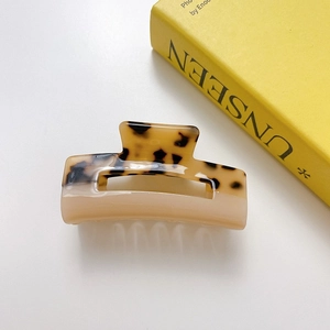 Square acetate hair claw clip with tortoise shell pattern and beige color block design