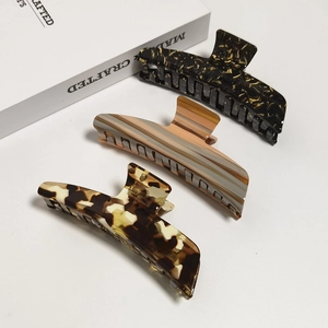 Three-piece set of elegant acetate shark hair clips in tortoiseshell and marble patterns