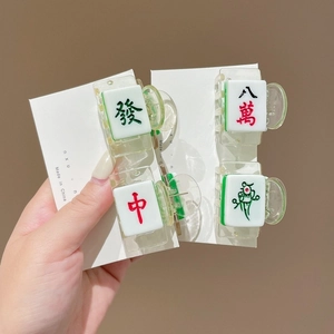 Set of four mini mahjong hair claws in translucent green acrylic for creative styling