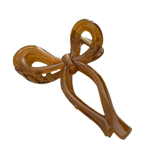 Elegant amber jelly acrylic bow hair claw clip with gold spring for women hair styling