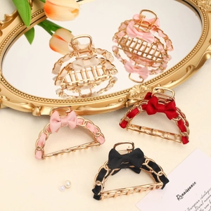 Elegant gold metal bow hair claws with hollow chain design in red, black, pink and cream