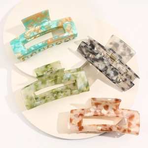 Set of four large square acetate hair claws in various elegant marbled patterns