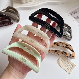 Elegant large acetate claw clips set in black pearl and tortoise shell for women