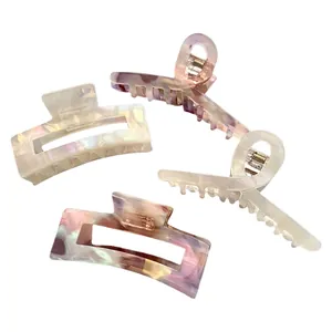 Large French style acetate hair claw clips in marble and floral patterns for women