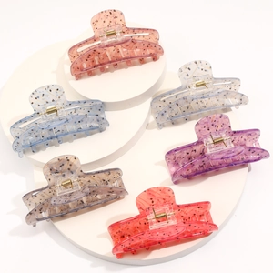 Set of 6 colorful acetate large shark hair claws in tortoise shell pattern on stands