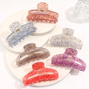 Set of six large acetic acid hair claws with marble texture and gold metal springs