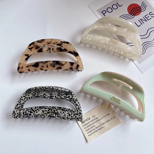 Set of four vintage acetate claw clips in tortoiseshell and marble patterns for women