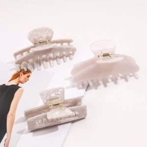 Three-piece set of cream marble acetate hair claws in various shapes for women