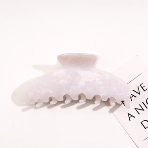 Detail of lavender acetate hair claw clip with marble texture for thick hair