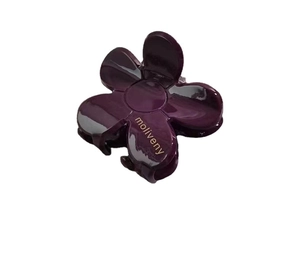 Glossy burgundy camellia flower hair claw clip with elegant golden lettering