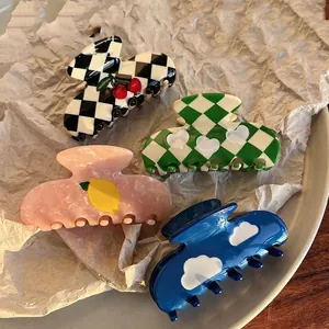 French vintage acetate hair claws featuring checkerboard cherry and heart patterns