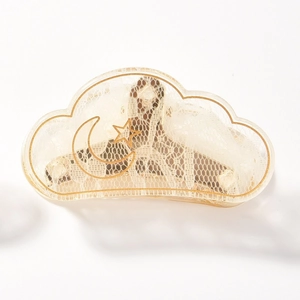Cloud-shaped acrylic hair claw with white lace and gold moon star pattern on white background