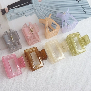 Colorful translucent resin hair claw clips set in eight assorted minimalist matte shades